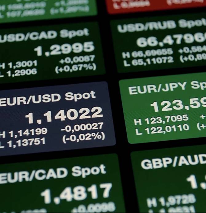 A digital display screen showing foreign exchange rates