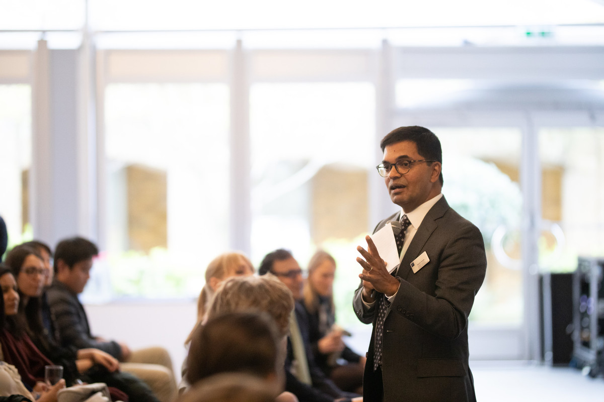 A faculty member delivering a speech